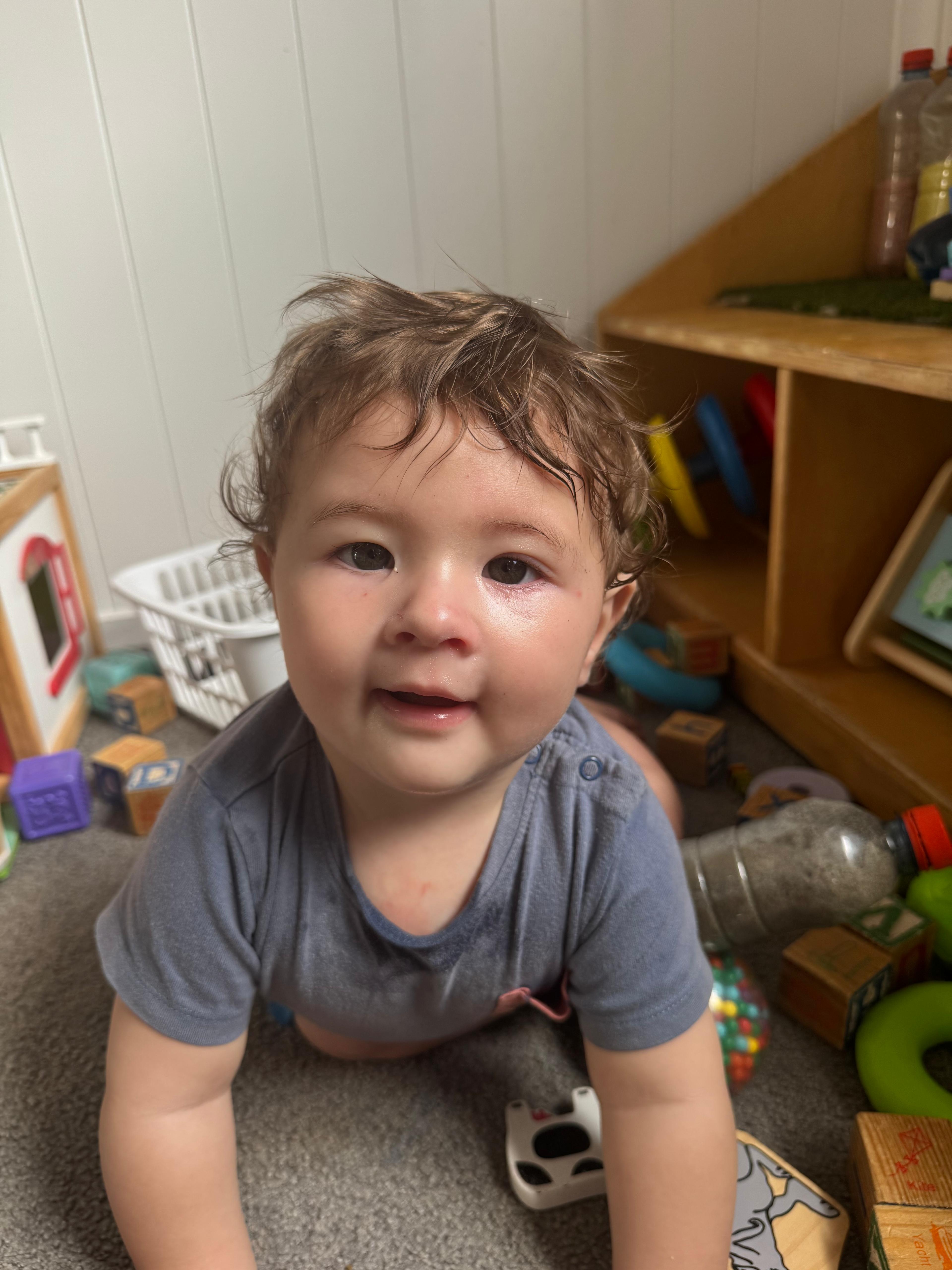 Toddler exploring with toys