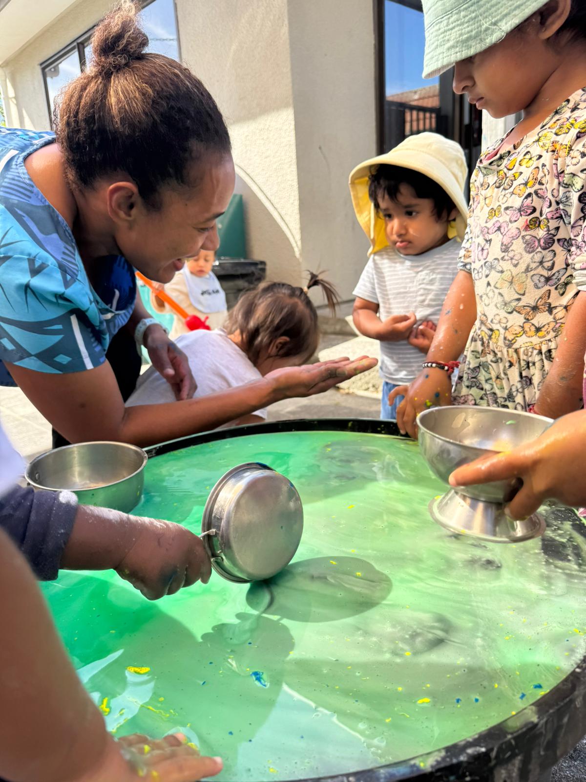 Children learning with their teacher at Little Village Preschool